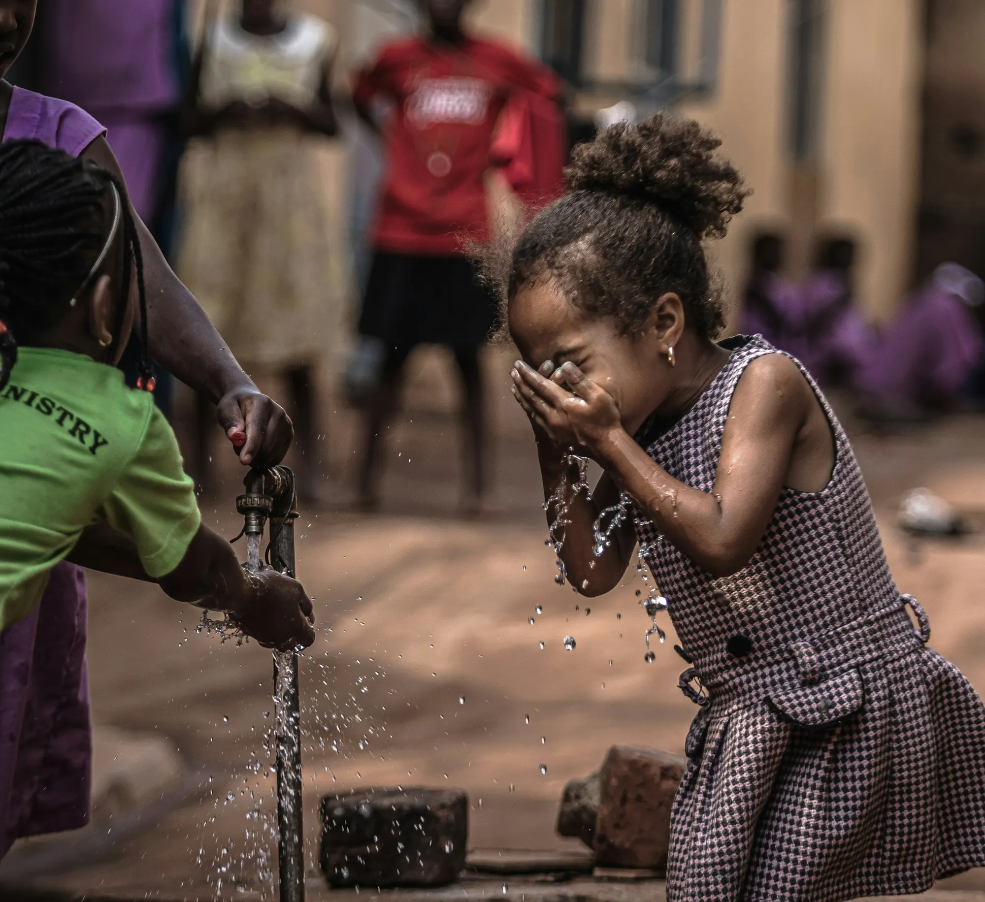 A girl drinking from a clean-water tap